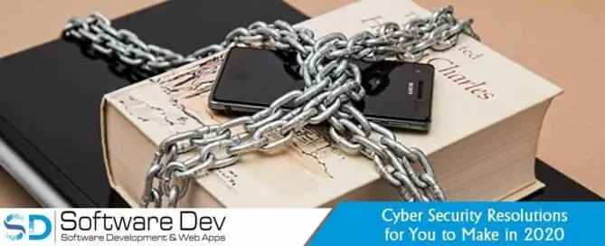 a phone book, laptop and computer mouse, stacked and chained together